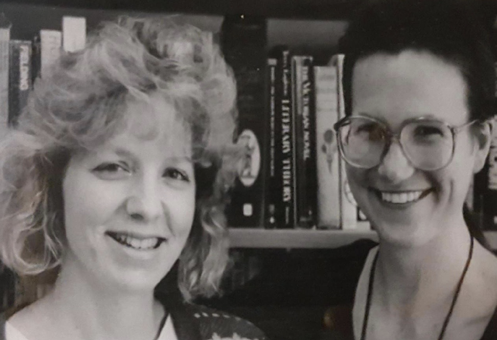 An double portrait of Pamela Corpron Parker and Cindy Lacom in front of a bookcase.
